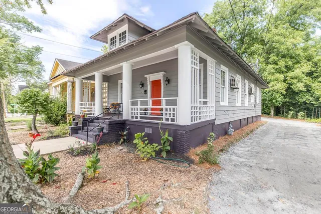 a front view of a house with garden