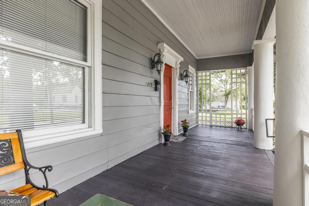 1475 3rd Street Macon, GA 31201 - Photo 8 of 37 a view of an empty room with wooden floor and windows