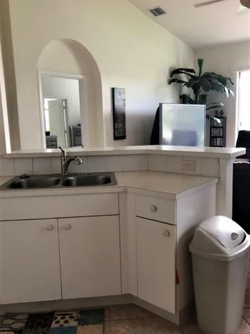 a bathroom with a sink and mirror