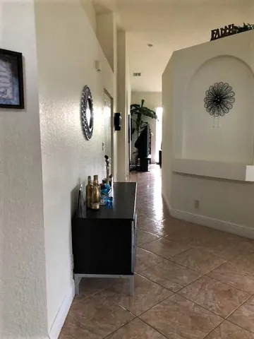 a view of a living room and entryway