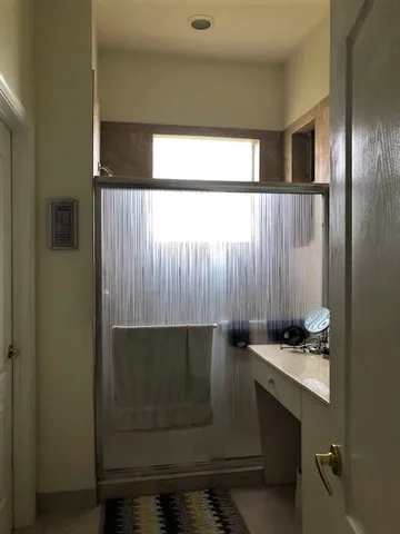 a room with a bench and cabinets