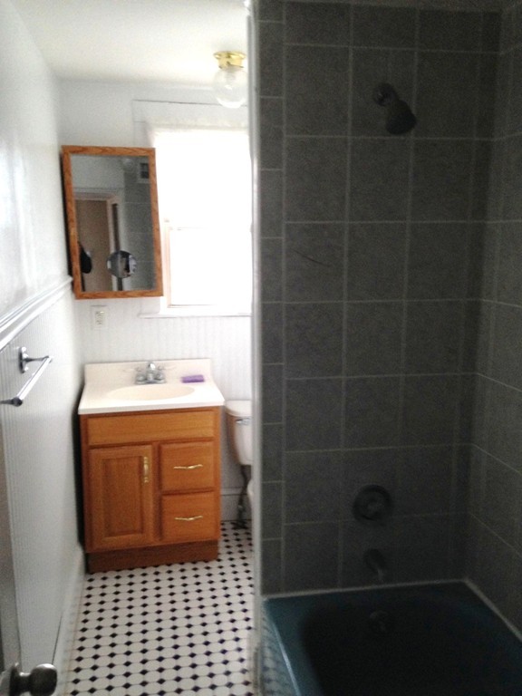 5 Malta Street Hull, MA 02045 - Photo 11 of 16 a bathroom with a sink a toilet and shower
