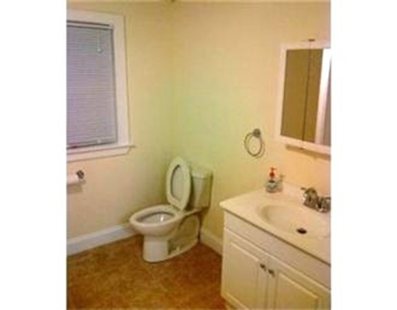 5 Malta Street Hull, MA 02045 - Photo 4 of 16 a bathroom with a sink mirror and toilet