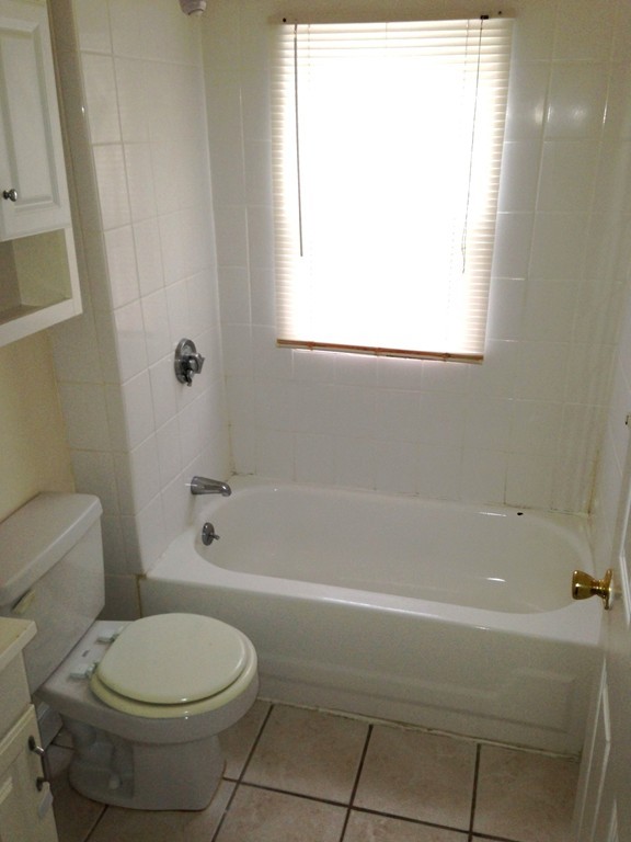 5 Malta Street Hull, MA 02045 - Photo 7 of 16 a bathroom with a toilet and a bath tub