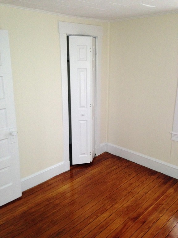 5 Malta Street Hull, MA 02045 - Photo 8 of 16 a view of an empty room with wooden floor and closet
