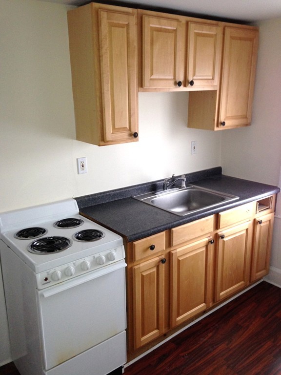 5 Malta Street Hull, MA 02045 - Photo 9 of 16 a kitchen that has a sink and a stove