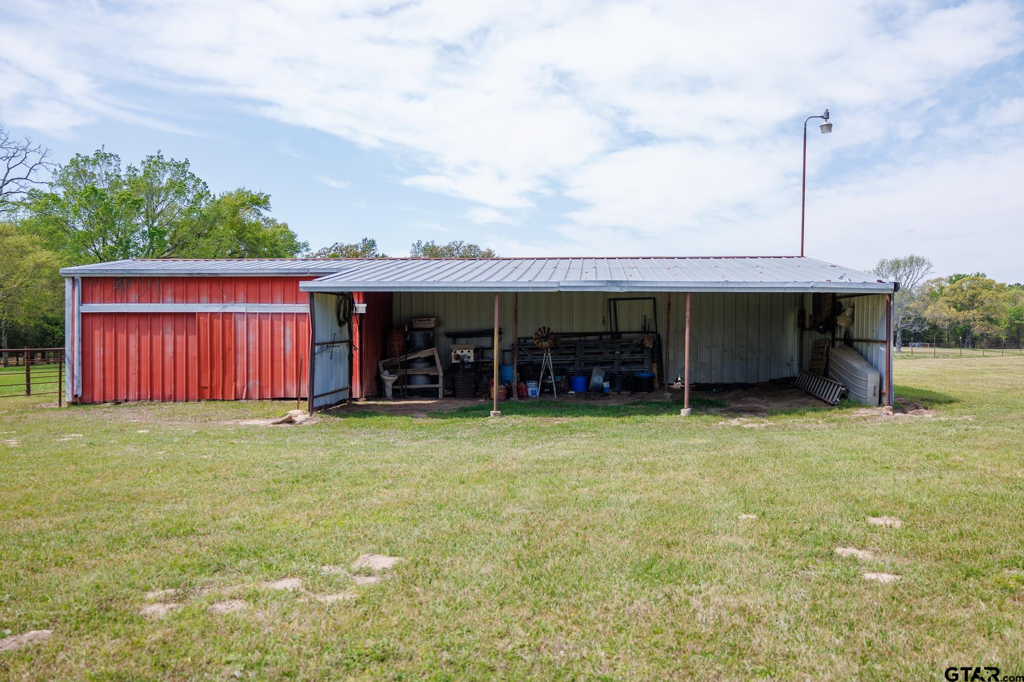 411 VZ County Road Ben Wheeler, TX 75754 - Photo 15 of 46 a view of a house with backyard porch and entertaining space
