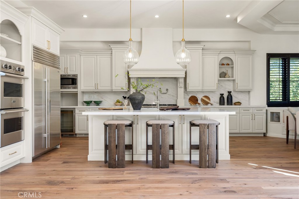 624 14th Street Manhattan Beach, CA 90266 - Photo 16 of 75 a kitchen with white cabinets and refrigerator