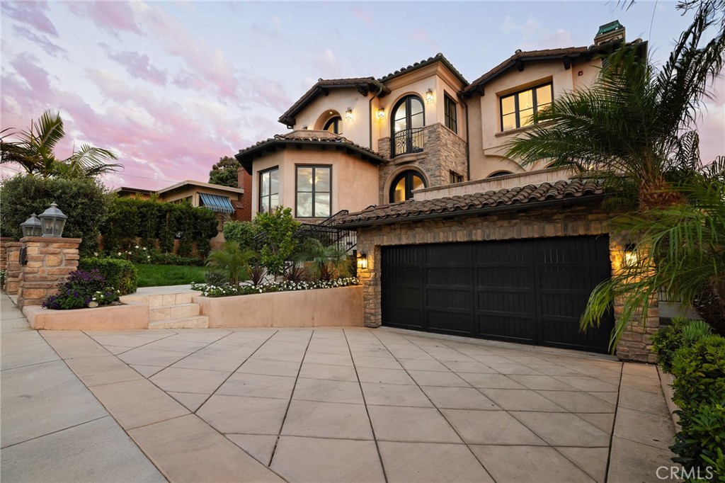 624 14th Street Manhattan Beach, CA 90266 - Photo 3 of 75 a front view of a house with a yard and garage