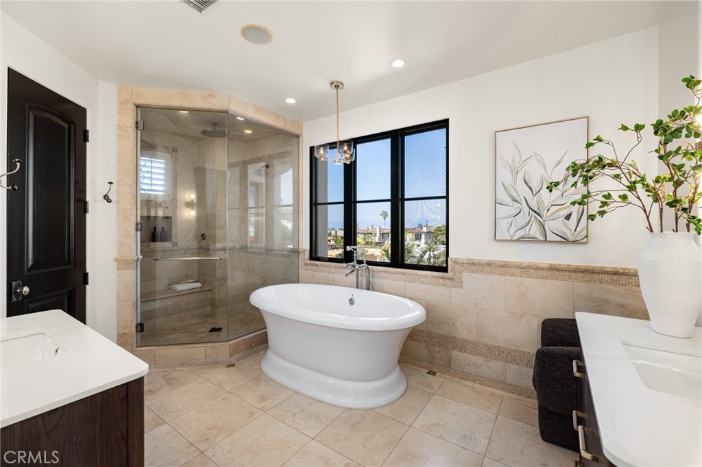 624 14th Street Manhattan Beach, CA 90266 - Photo 53 of 75 a spacious bathroom with a bathtub shower sink mirror and toilet