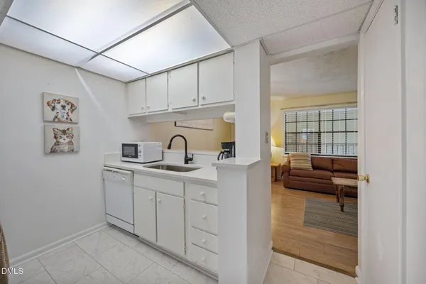a kitchen with a sink and cabinets