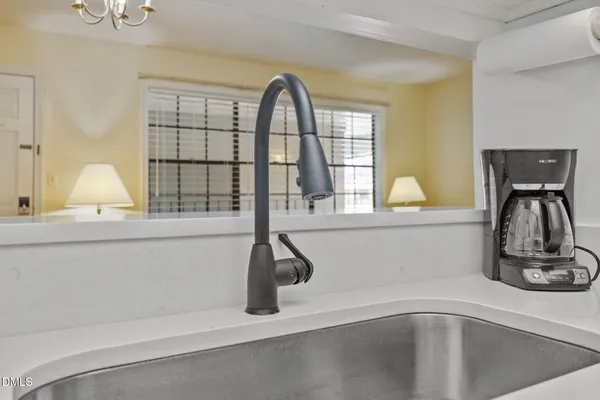 a bedroom with two beds and a window