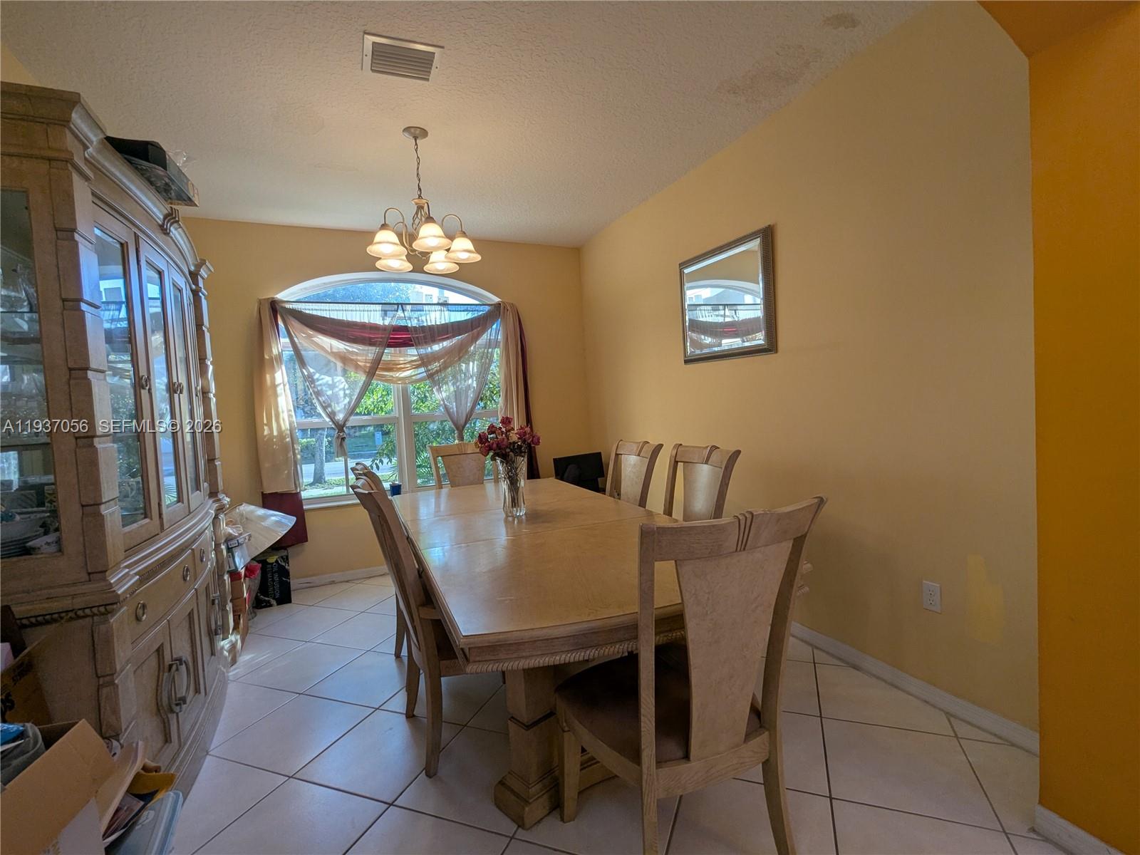 12641 Southwest 28th Street Miramar, FL 33027 - Photo 12 of 61 a view of a dining room with furniture window and outside view