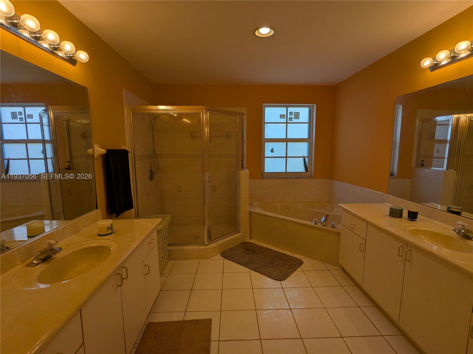12641 Southwest 28th Street Miramar, FL 33027 - Photo 19 of 52 Spacious primary bathroom with double vanities and separate glass shower