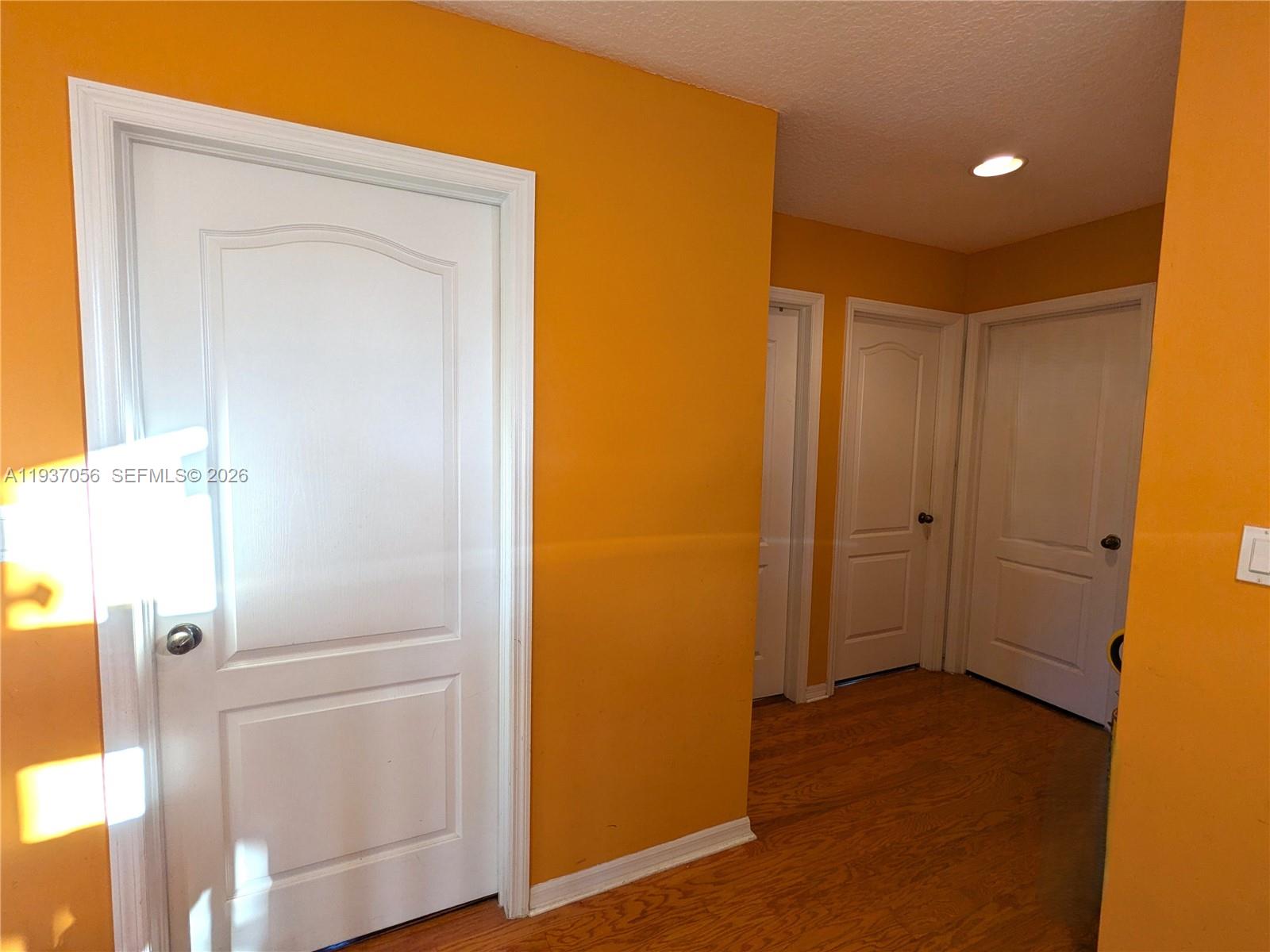 12641 Southwest 28th Street Miramar, FL 33027 - Photo 24 of 52 Central hallway providing access to three bedrooms and 2nd bathroom