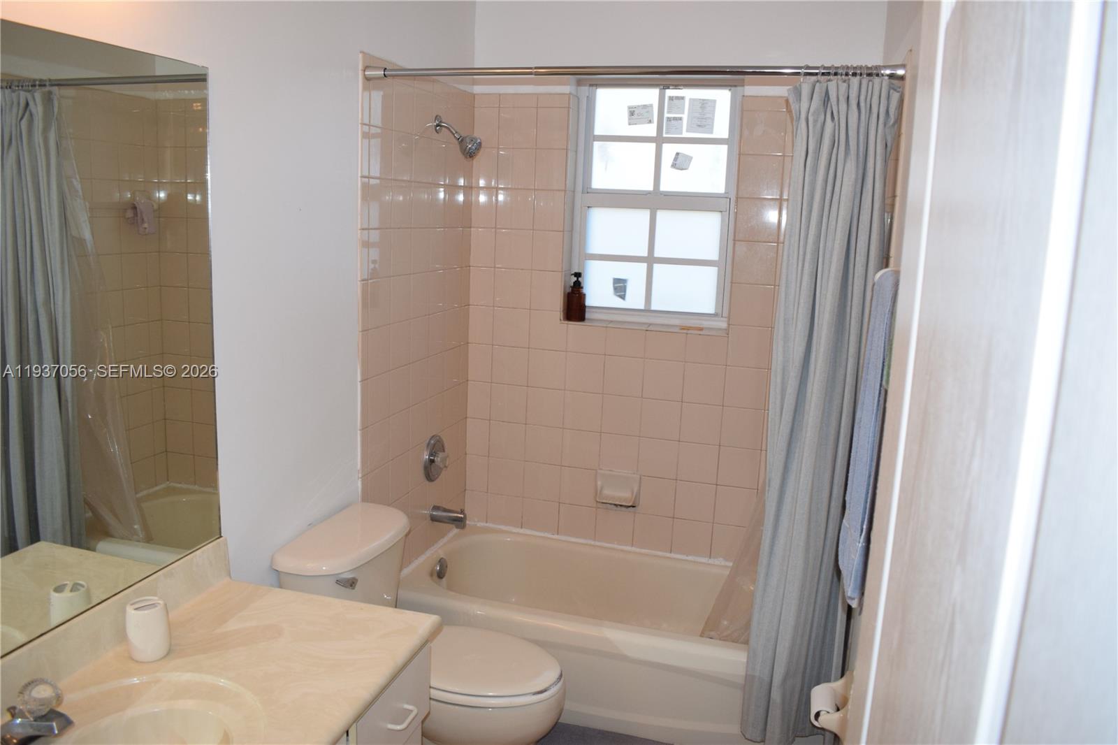 12641 Southwest 28th Street Miramar, FL 33027 - Photo 30 of 61 a bathroom with a sink toilet and shower