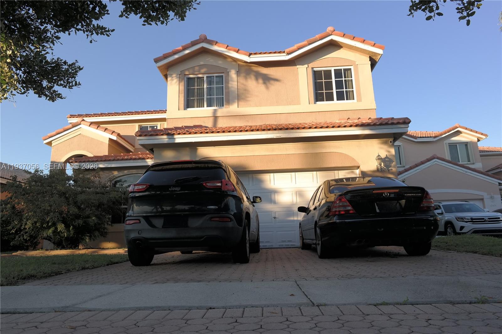 12641 Southwest 28th Street Miramar, FL 33027 - Photo 31 of 61 a car parked in front of a house