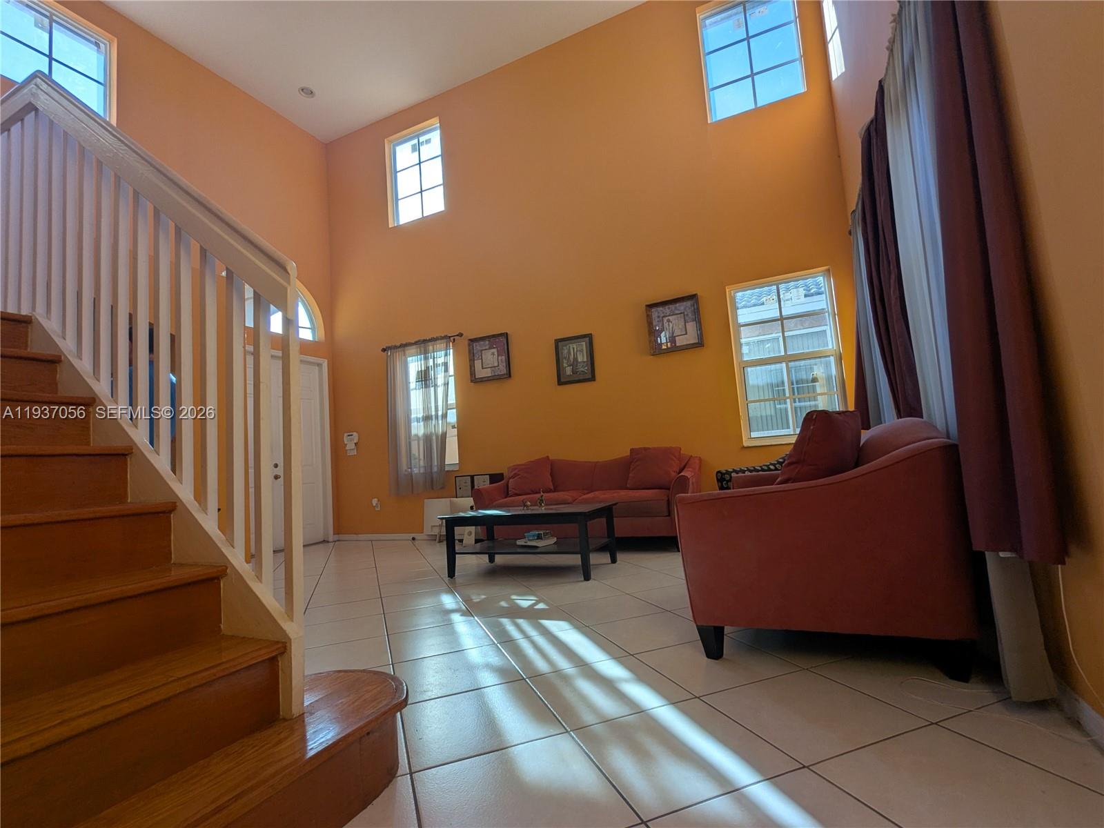12641 Southwest 28th Street Miramar, FL 33027 - Photo 35 of 61 a living room with furniture and a window