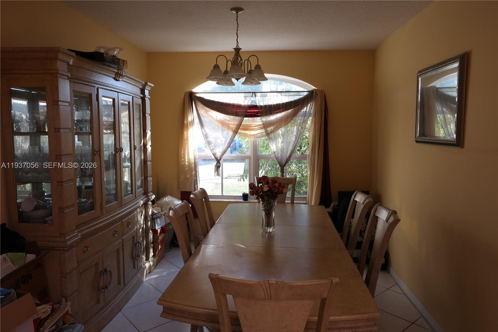 12641 Southwest 28th Street Miramar, FL 33027 - Photo 37 of 61 a view of a dining room with furniture window and wooden floor