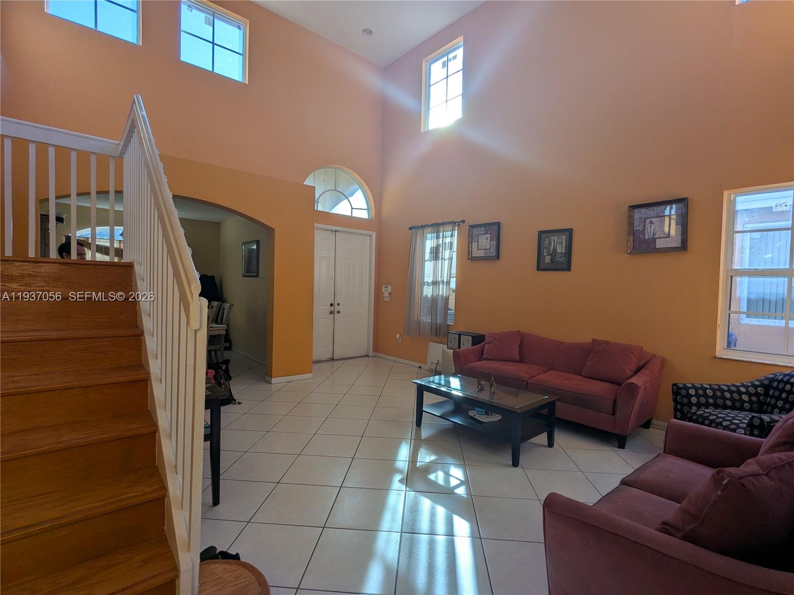 12641 Southwest 28th Street Miramar, FL 33027 - Photo 4 of 61 a living room with furniture and a window