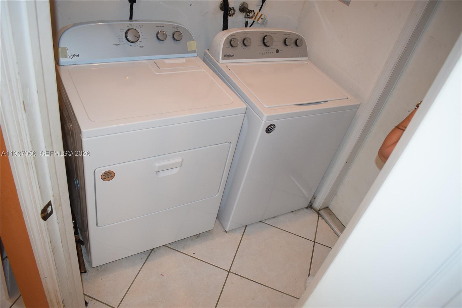 12641 Southwest 28th Street Miramar, FL 33027 - Photo 44 of 61 a utility room with dryer and washer