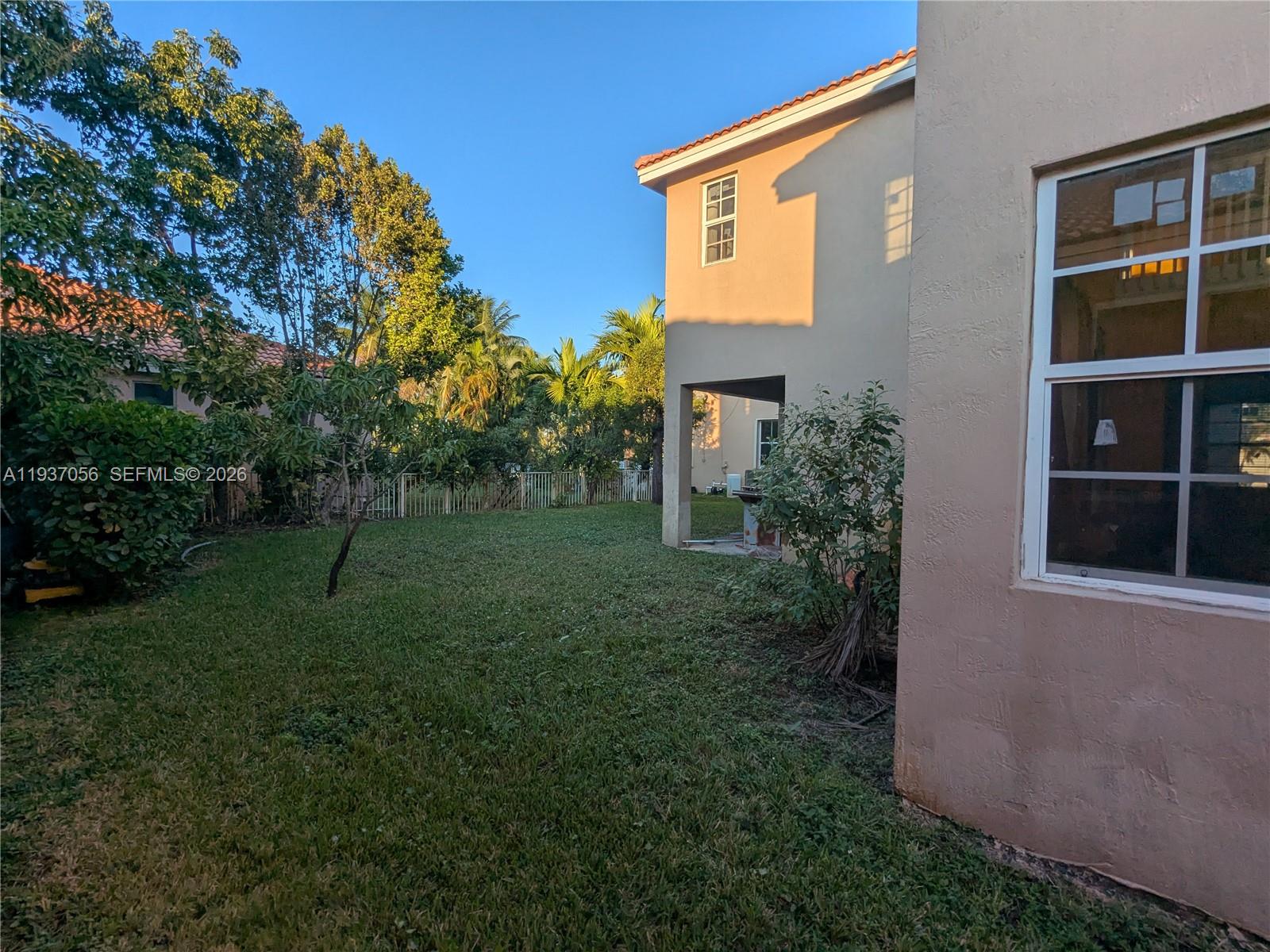12641 Southwest 28th Street Miramar, FL 33027 - Photo 48 of 61 a view of a house with backyard and garden