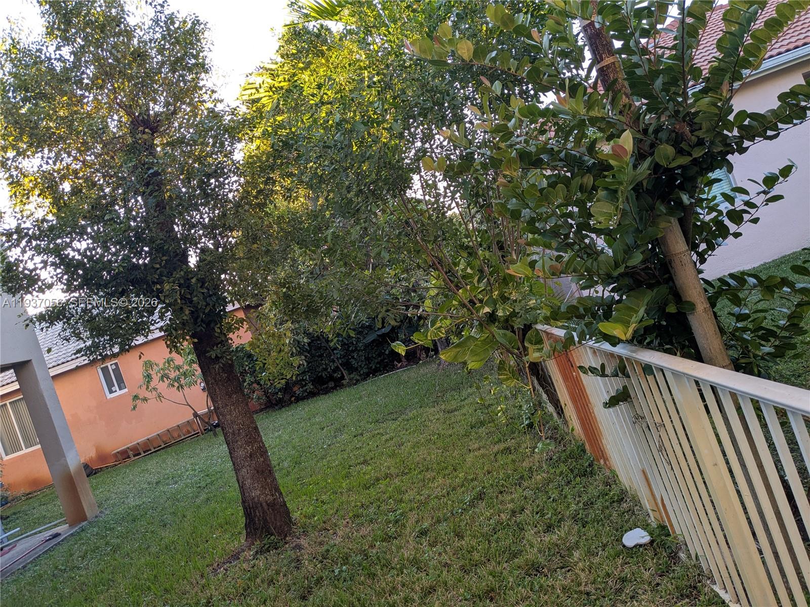 12641 Southwest 28th Street Miramar, FL 33027 - Photo 50 of 61 a view of a yard with large trees