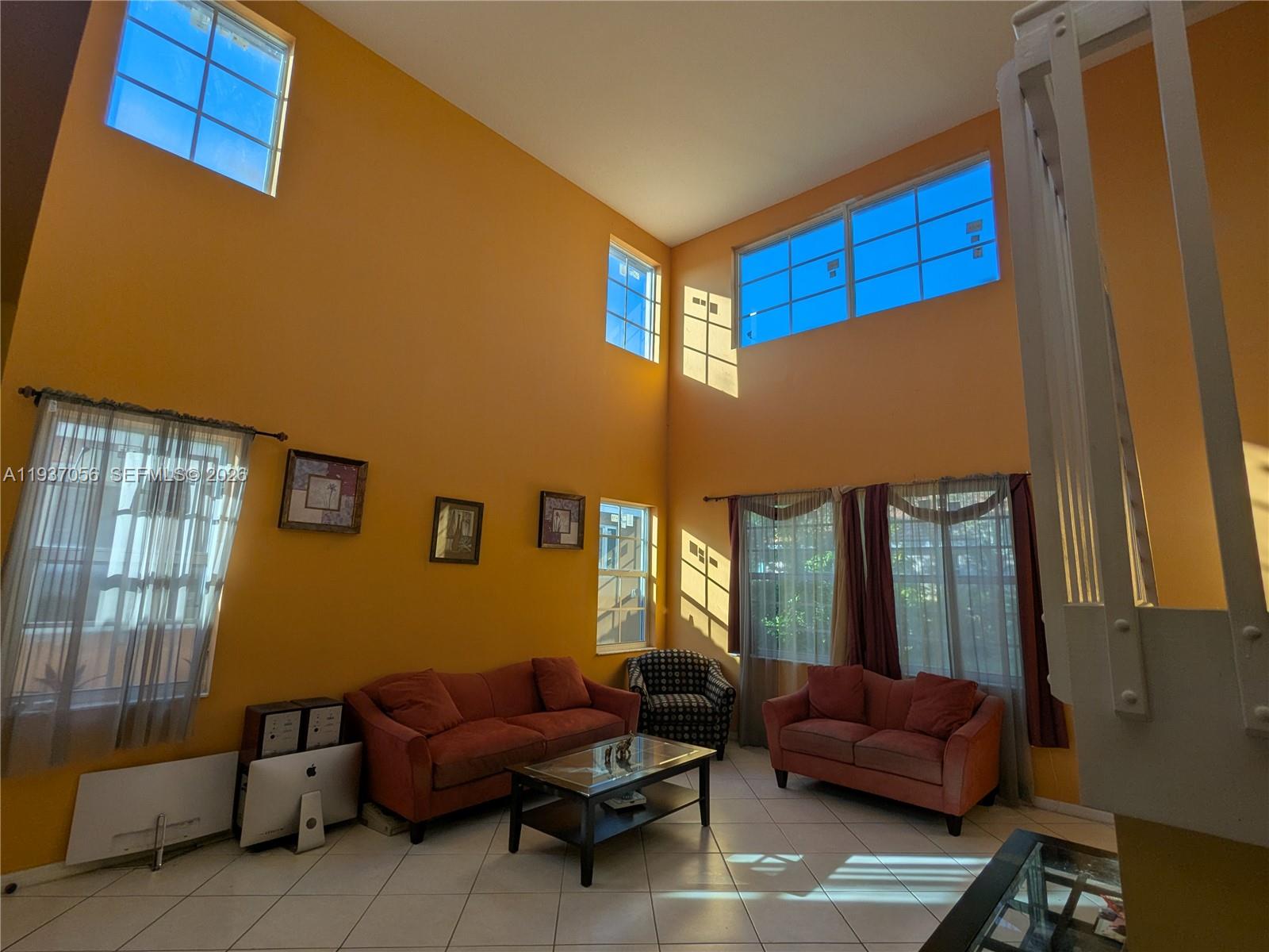 12641 Southwest 28th Street Miramar, FL 33027 - Photo 5 of 61 a living room with furniture and a window