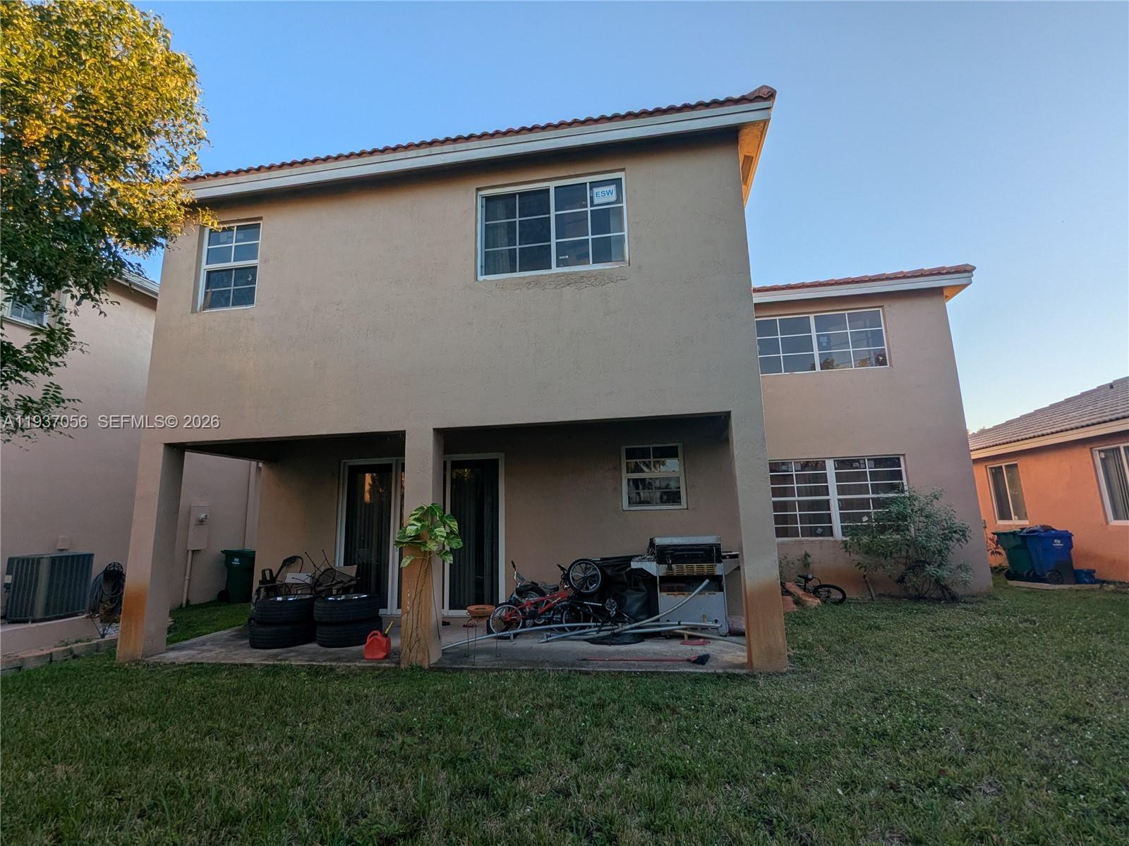 12641 Southwest 28th Street Miramar, FL 33027 - Photo 54 of 61 a view of house and yard with trees