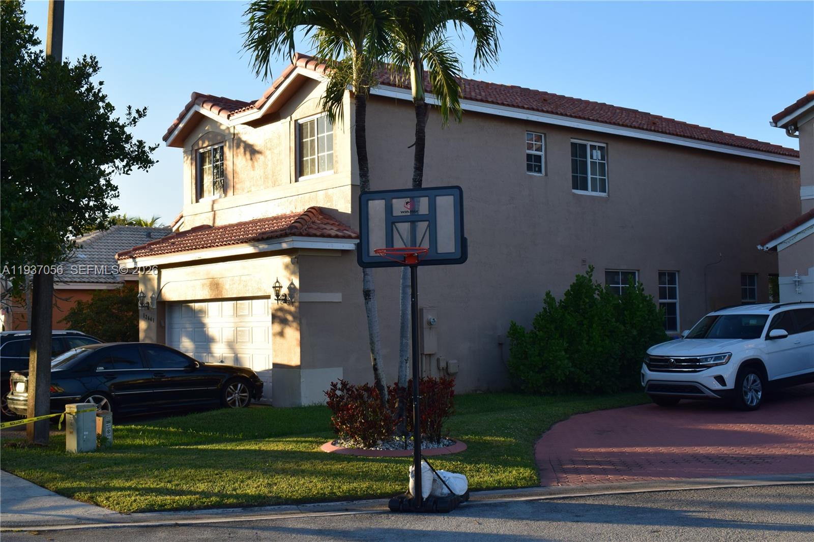 12641 Southwest 28th Street Miramar, FL 33027 - Photo 56 of 61 a front view of a house with garden