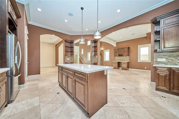 a bathroom with a granite countertop sink toilet and a mirror