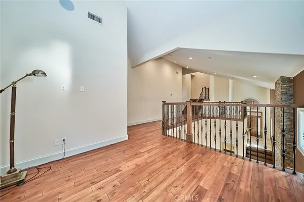 a view of a balcony with wooden fence