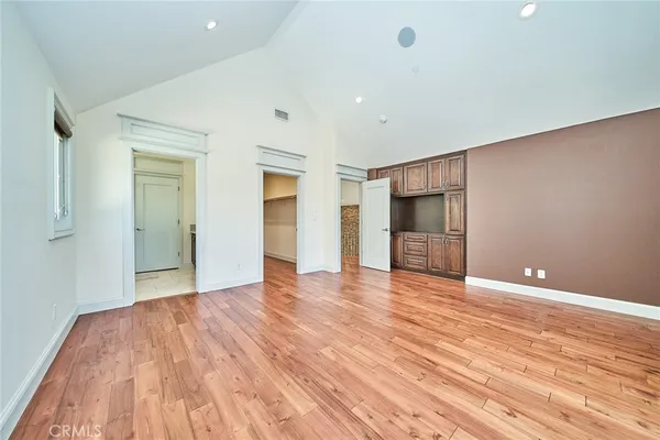 a spacious bathroom with a granite countertop sink mirror and shower