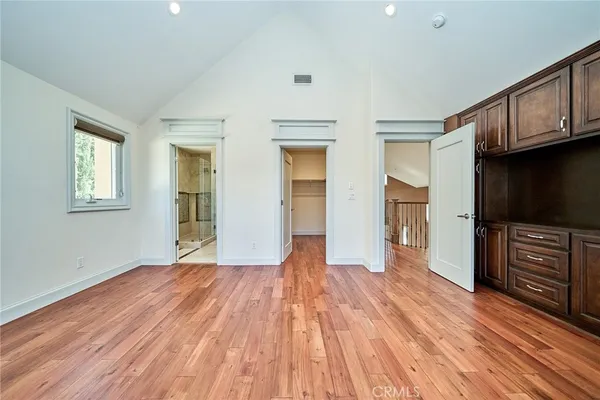 a view of entryway with wooden floor and stairs