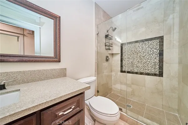 a view of a porch with chairs and backyard