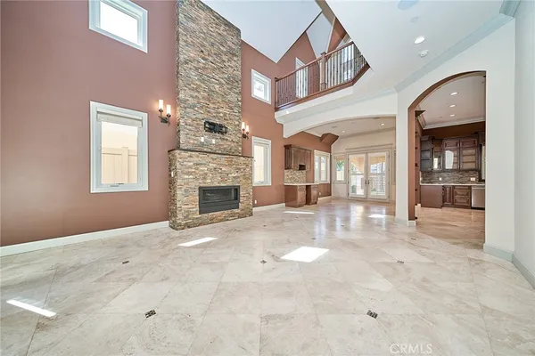 a large kitchen with stainless steel appliances kitchen island granite countertop a large stove top oven and cabinets