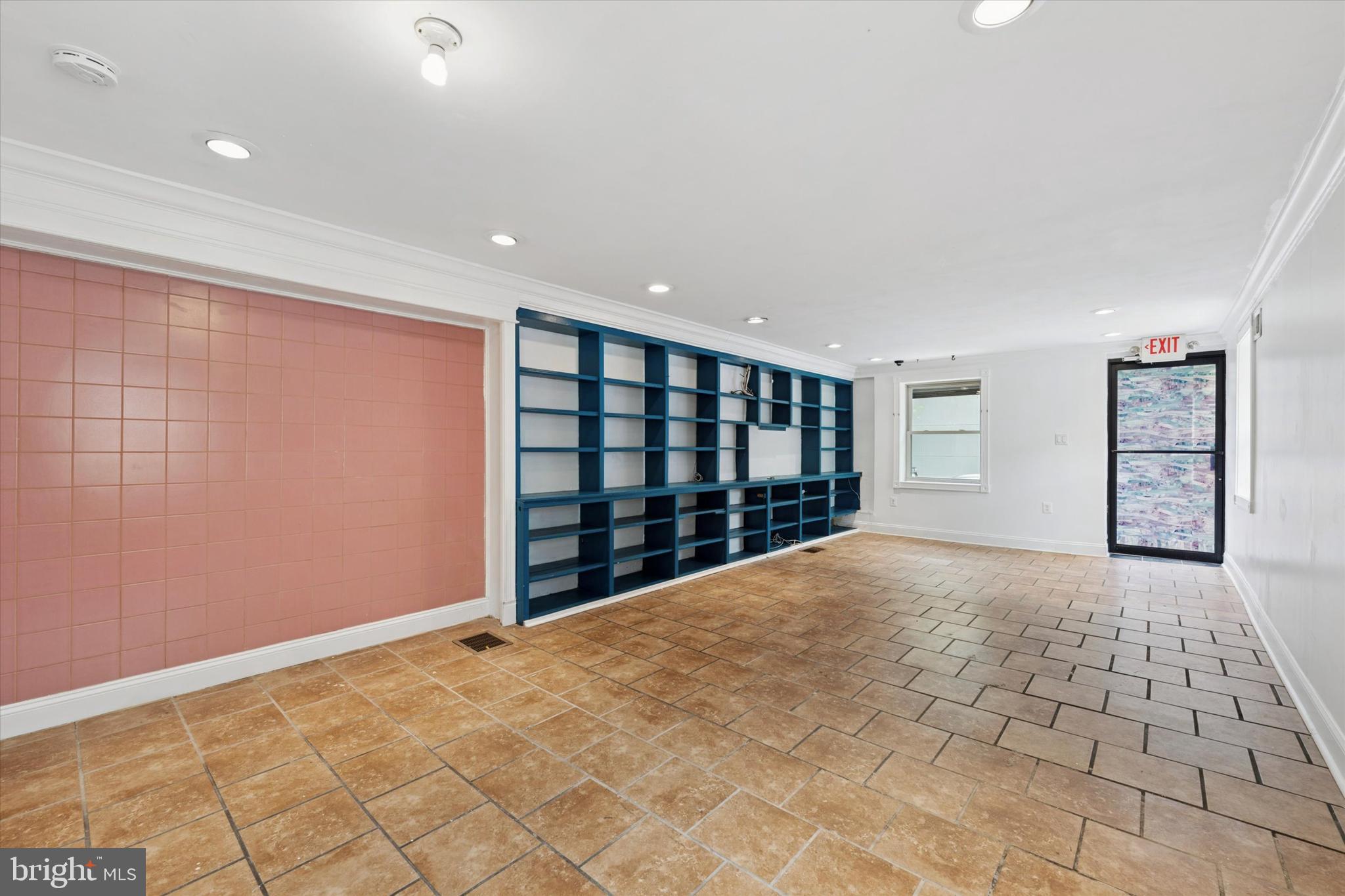 a view of an empty room with closet