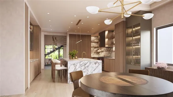 a kitchen with a dining table chairs and chandelier