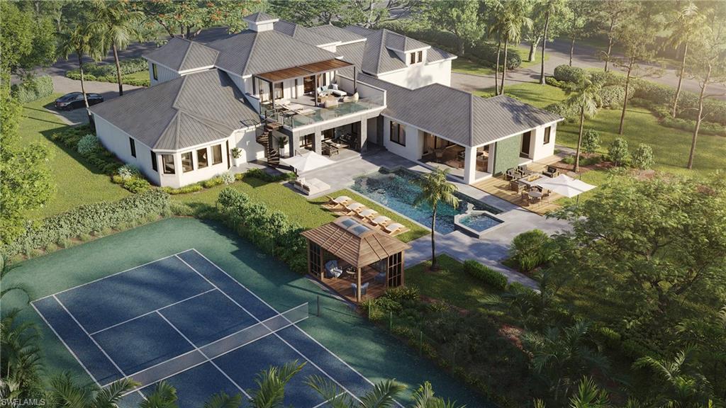 122 Caribbean Road Naples, FL 34108 - Photo 4 of 14 an aerial view of a house with a garden