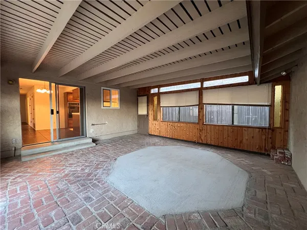a view of a room with wooden walls
