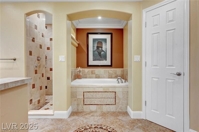 2410 Doherty Way Henderson, NV 89014 - Photo 43 of 63 Bathroom with a tile shower, a garden tub, and ornamental molding