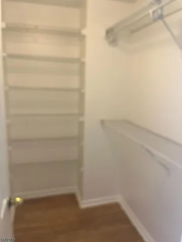 a empty closet with a white paint wall
