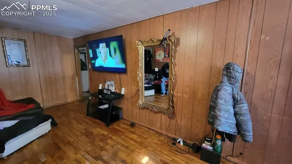 a room with furniture and wooden floor