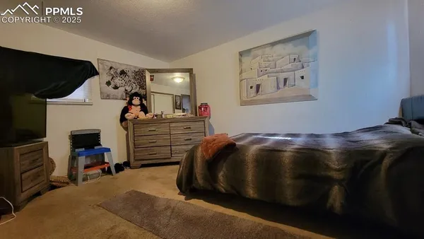 a bedroom with a bed and furniture