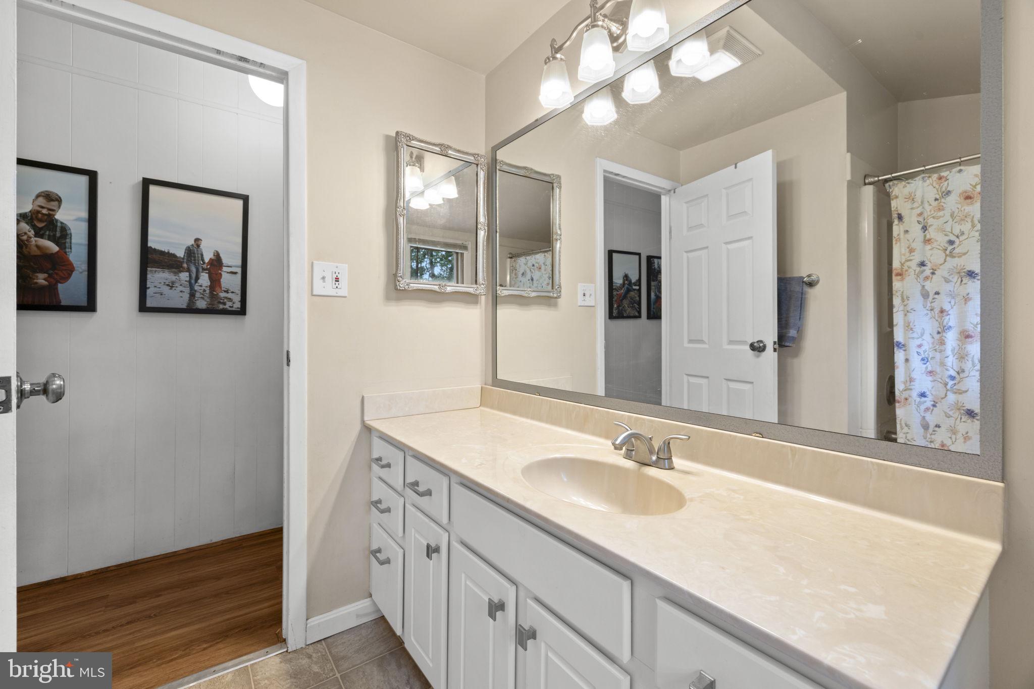 9448 Green Road Midland, VA 22728 - Photo 52 of 91 a bathroom with a sink vanity granite and a mirror