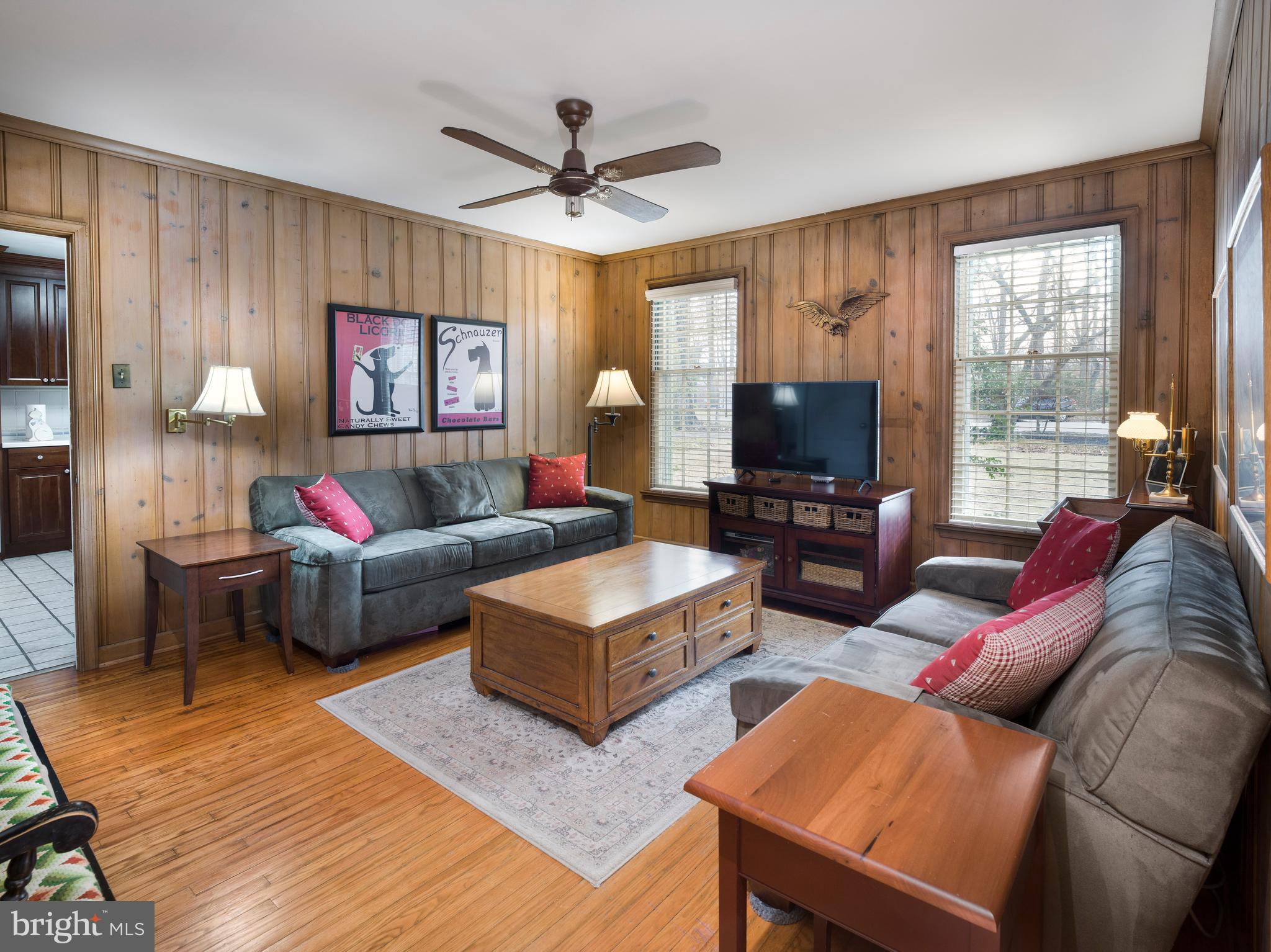 34 Ridgewood Road Wayne, PA 19087 - Photo 11 of 28 a living room with furniture flat screen tv and a window