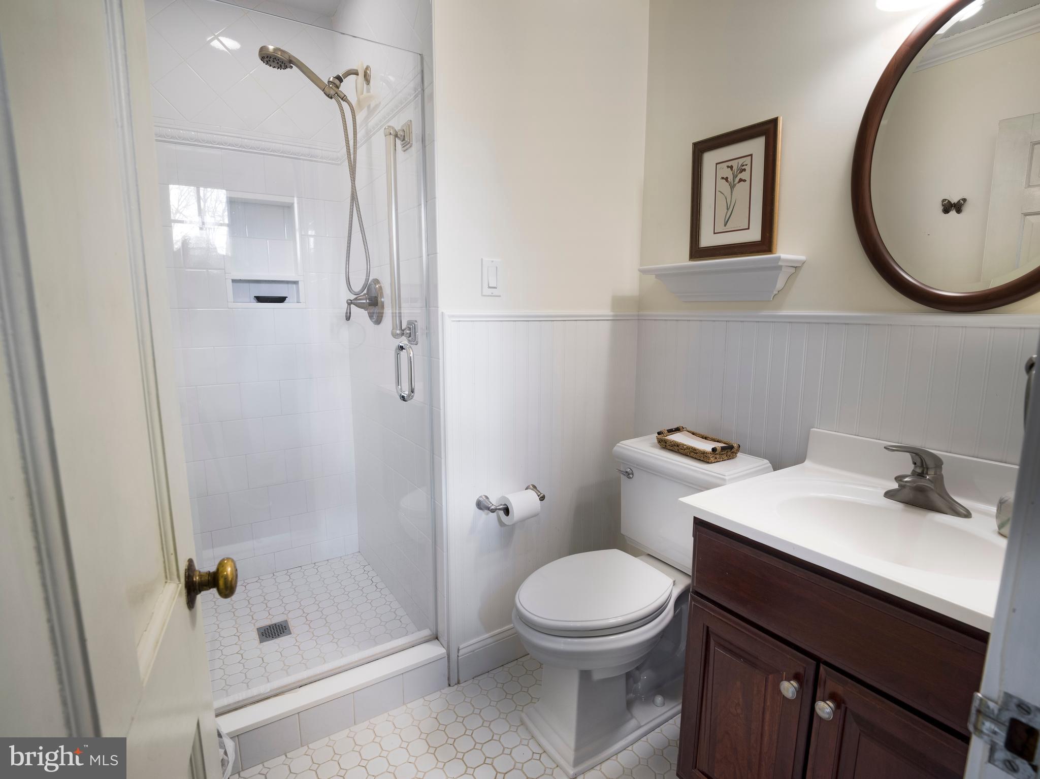 34 Ridgewood Road Wayne, PA 19087 - Photo 14 of 28 a bathroom with a sink a toilet and shower