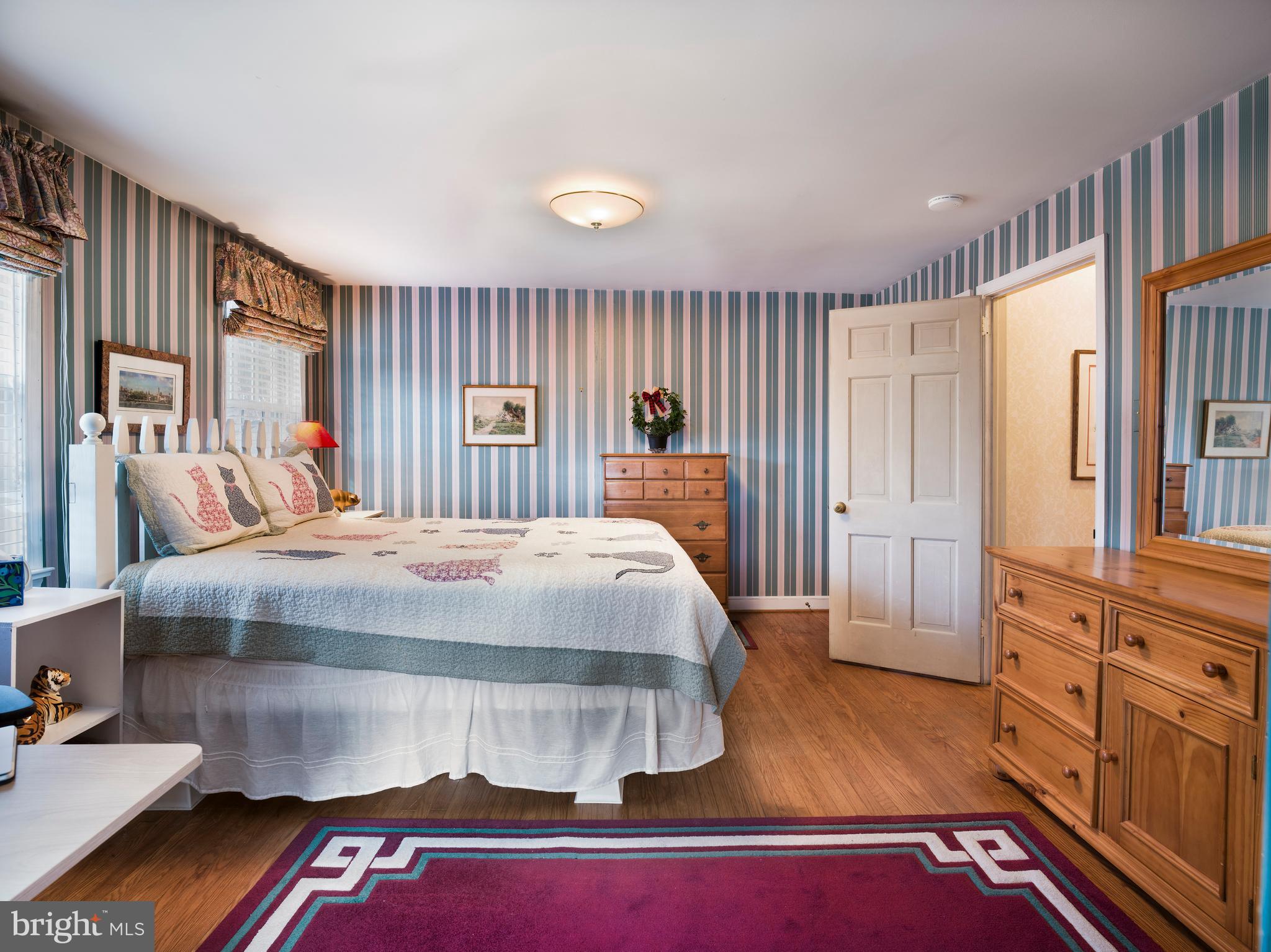 34 Ridgewood Road Wayne, PA 19087 - Photo 23 of 28 a bed sitting in a bedroom next to a window