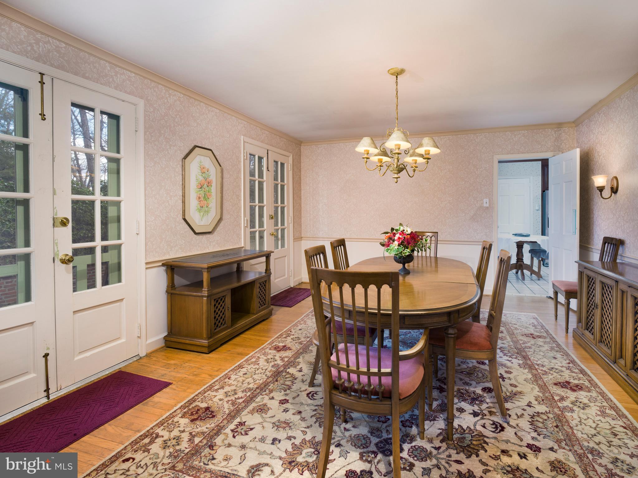 34 Ridgewood Road Wayne, PA 19087 - Photo 7 of 28 a dining room with furniture a rug a potted plant and a rug