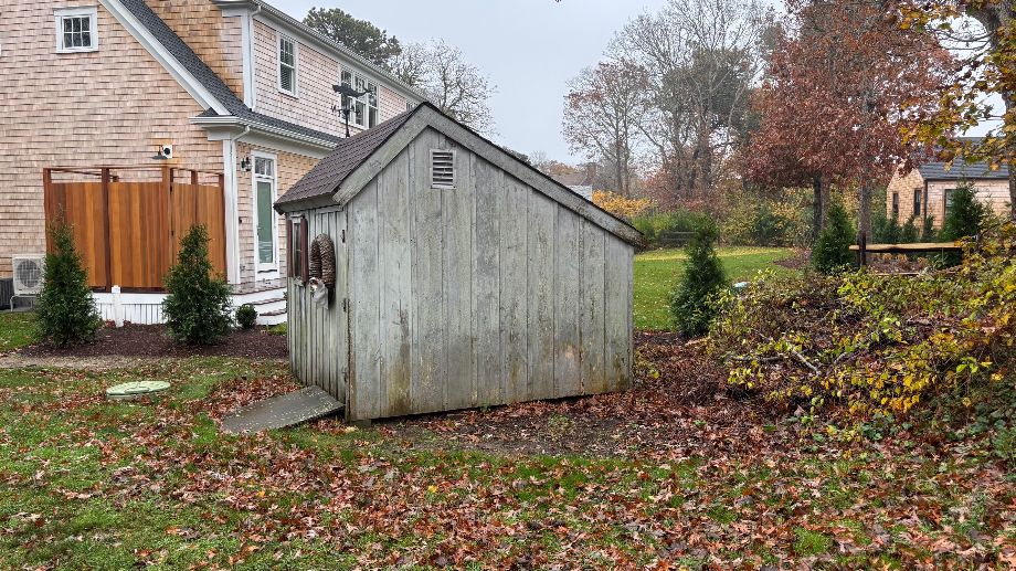 76 Norton Orchard Road Edgartown, MA 02539 - Photo 4 of 7 a backyard of a house with lots of green space